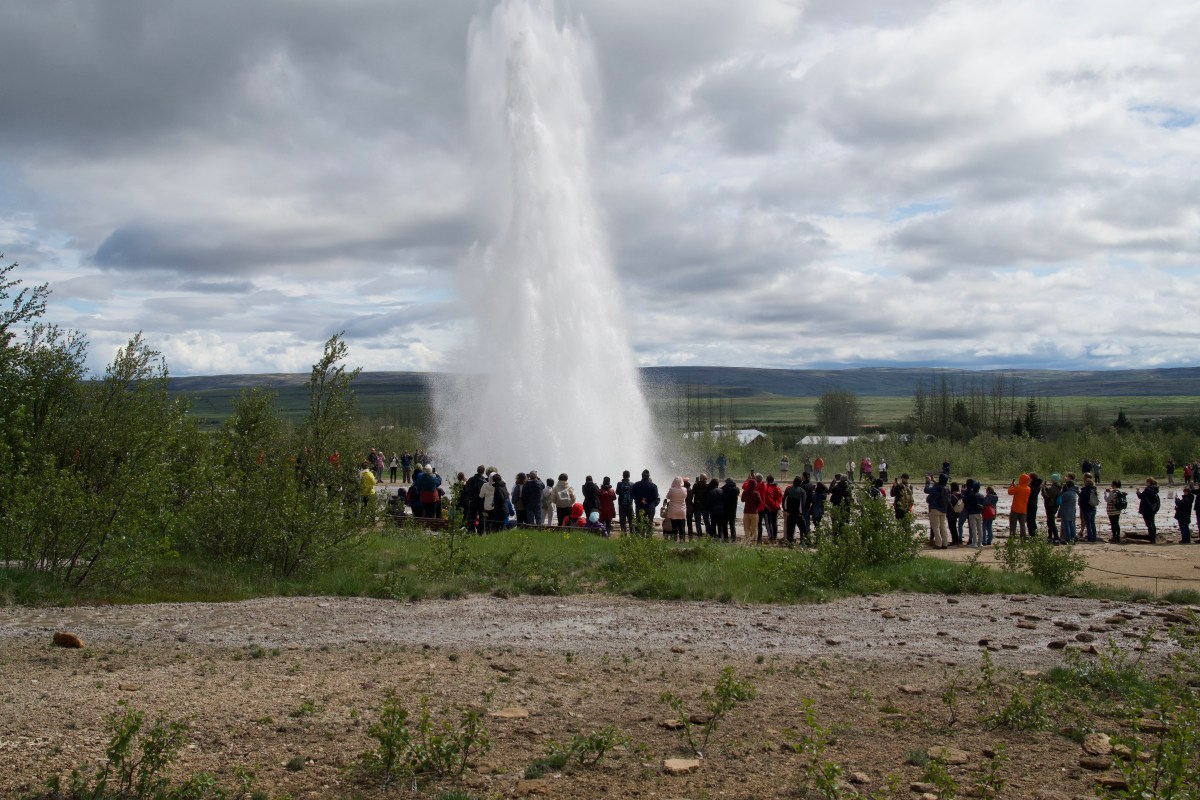 Gyser, water shooting into the air under pressure.